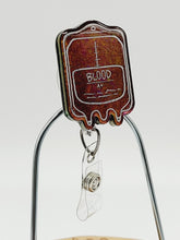 Load image into Gallery viewer, Color Shift Blood Bag Badge Reel: Medical Blood Bag Retractable Badge Reel
